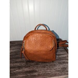 Urban Expressions caramel colored backpack with gold accents